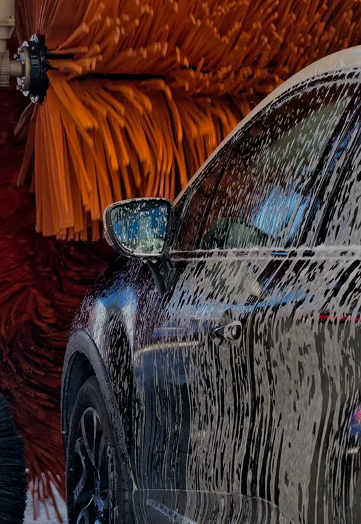 A car moving through a commercial car wash