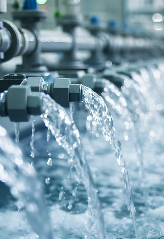 Water running from an array of institutional pipework